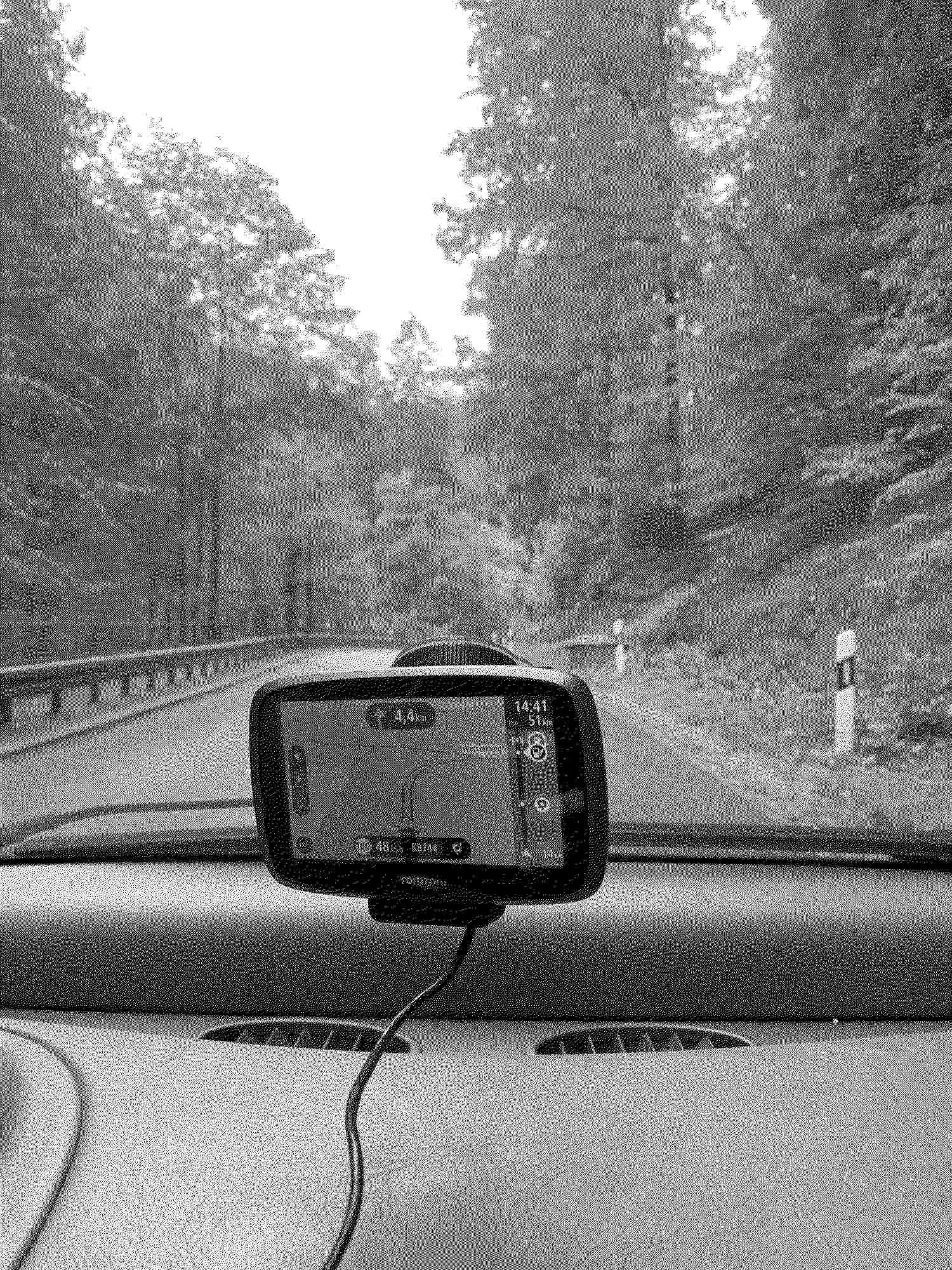 GPS and road curving ahead out the front window of a car in Saxon Switzerland